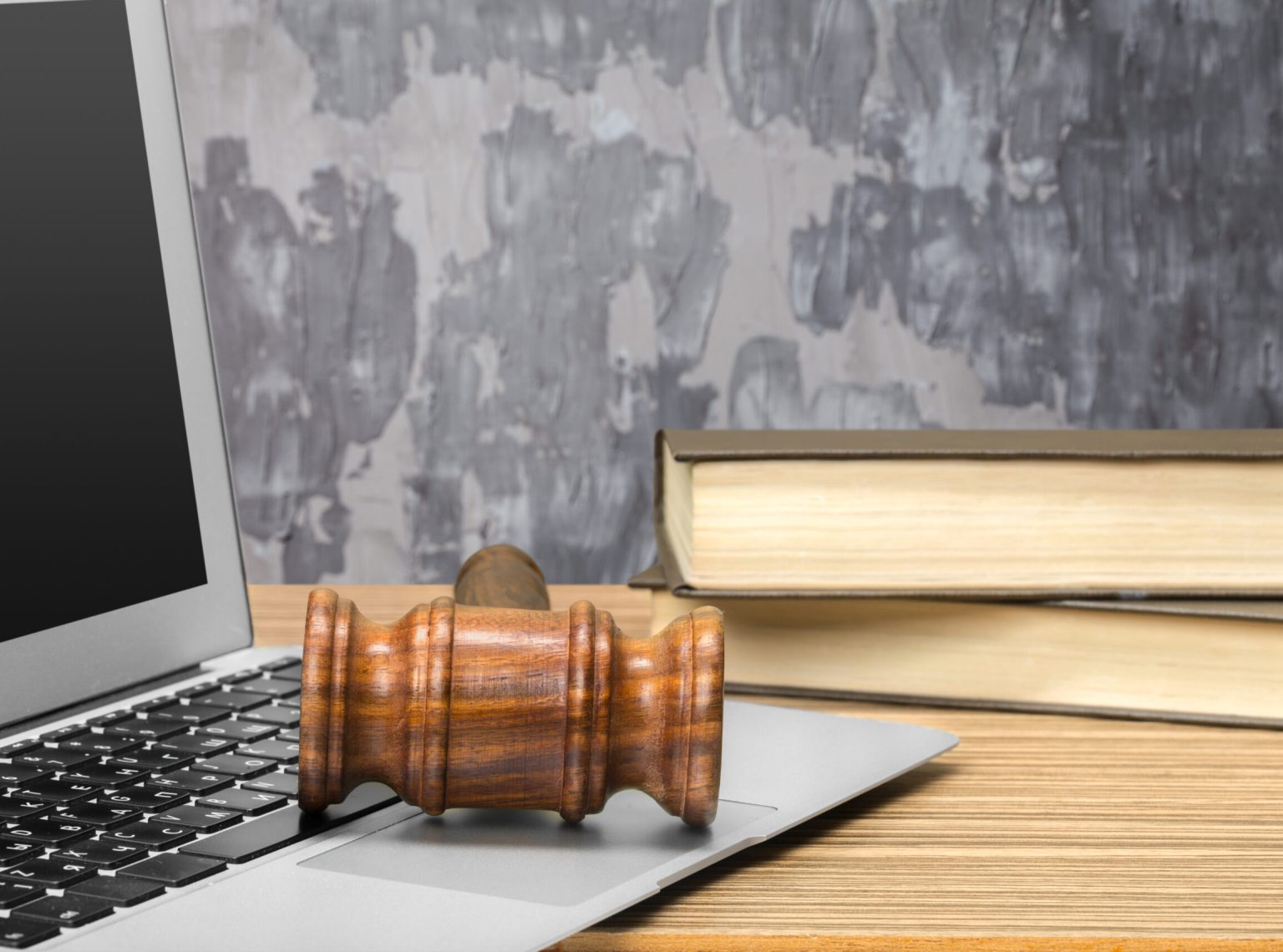 Laptop And Mallet On Table